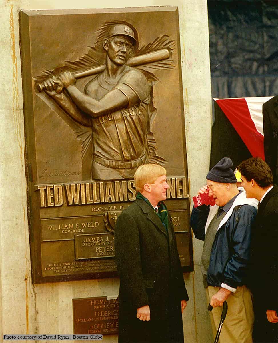 photo of bronze relief plaque of Ted Williams during dedication ceremony with people in front of it